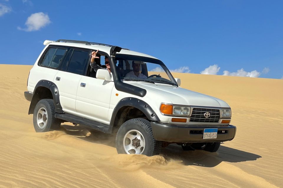 From Cairo: Desert Safari, Camel Ride, Magic Lake, & Lunch - The Real Star Part 2: Sandboarding on Soft Desert Sand